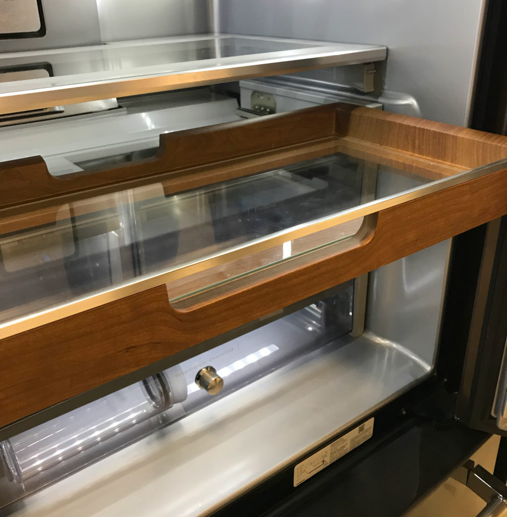 Simulated wood hydrographics for a high-end refridgerator